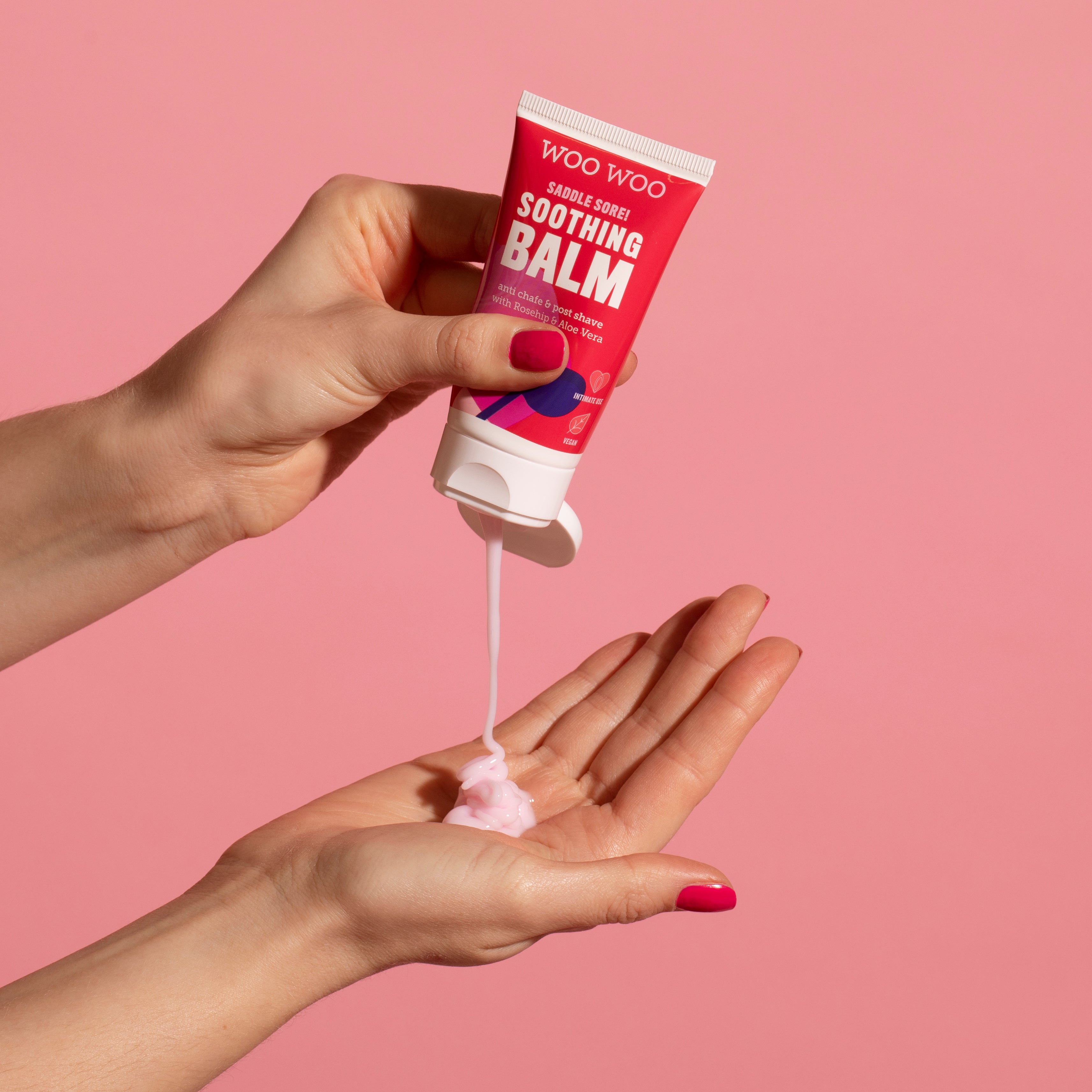 Tube of Soothing Balm being poured into an open hand