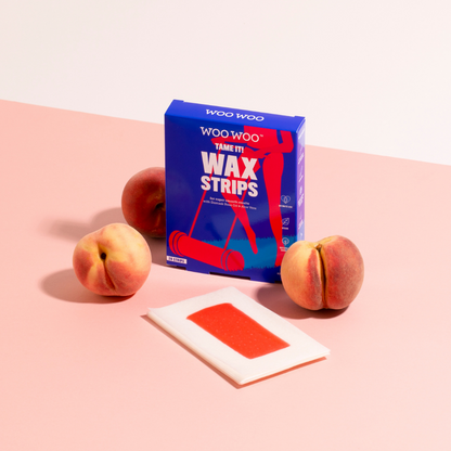 Packet of WooWoo wax strips surrounded by peaches